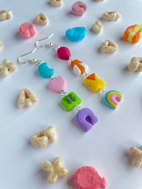 Lucky Charm earrings handmade out of polymer clay. Earrings are about 2.5 inches long. Lucky Charms Earrings, Polymer Clay Lucky Charms, Lucky Charm Earrings, Diy Earrings Clay, Cereal Earrings, Easy Clay Earrings, Clay Charm Ideas, Silly Earrings, Crazy Earrings