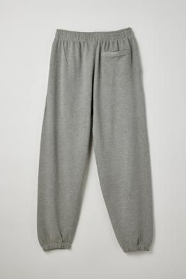 Super comfortable tracksuit bottoms from BDG. Cut from a cotton jersey fabrication with an elasticated waistband, side pockets and a baggy fit through the leg. Complete with cuffed hems. Only at BDG. **Content + Care** \- 80% Cotton, 20% Polyester \- Machine wash **Size + Fit** \- Model is wearing a size Medium \- Inseam: 78cm \- Leg opening: 14.5cm \- Measurements taken from a size Medium | BDG Bonfire Grey Joggers Pant - Grey XL at Urban Outfitters Mens Grey Sweatpants, Joggers Grey, Baggy Sweatpants, Grey Sweats, Sweatpants Outfit, Grey Sweatpants, Grey Joggers, Tracksuit Bottoms, Jogger Sweatpants