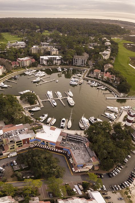 Aerial view of one of the most popular Hilton Head marinas at sunset with the Calibogue Sound visible in the distance Shelter Cove Hilton Head, Hilton Head South Carolina, Hilton Head Island South Carolina, 2024 Moodboard, Harbour Town, Boat Trip, Free Canvas, On A Boat, Modern Photography