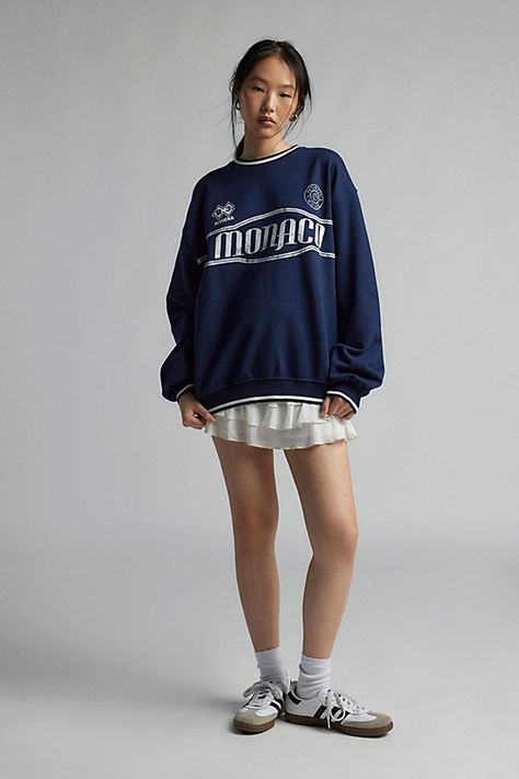 Well-traveled graphic crew neck sweatshirt featuring with a Monaco graphic at the chest Designed in a slouchy, oversized fit with contrast striping at the neckline, cuffs, and hem. Only at Urban Outfitters. Features Monaco Riviera crew neck sweatshirt Graphic crew neck pullover Crew neckline & balloon sleeves with contrast-striped ribbed trim Monaco Riviera graphic across the front Ribbed knit banded hem with contrast stripe Relaxed, oversized fit Regular length Easy pull-over style UO exclusive Sports Crew Neck Sweatshirt, Urban Crewneck, Sweatshirt Graphic, Fashion Guide, Field Hockey, Balloon Sleeves, Oversized Fits, Dublin, Edinburgh