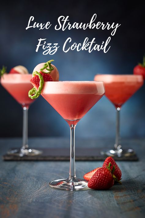 This cocktail with strawberry purée, gin, egg white, lime, and rosemary is perfect for any celebration!   #californiastrawberries #cocktail #dessertcocktail #mixology #fizzcocktail #mocktail #bartendingathome #cocktailrecipes #drinks #strawberrycocktail #holidayrecipes #mothersday #cheers #happyhour Cocktails With Strawberries, Cocktails With Strawberry Simple Syrup, Gin Strawberry Cocktail, Strawberry Lemon Mocktail, Gin And Strawberry Cocktail, Strawberry Cocktail Recipe, Strawberry Fizz Cocktail, Strawberry Purée, Beefeater Strawberry Gin Cocktail