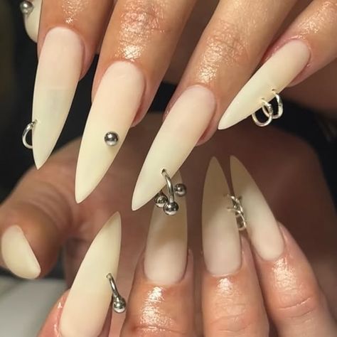 Le Labo 21 •Nail art & tooth gems •Paris on Instagram: "🦴+🪛=⛓️🖤 

@apresnailofficial long stilettos 

#gelxnails #gelx #apresnails #mattenails #piercing #longnails #stilettosnails #halloween #realistic #nailart" Piercing Nail Art, Tooth Nails, Pierced Nails, Piercing Nails, Jewelry Nails, Nail Piercing, Tooth Gems, Tooth Gem, Matte Nails