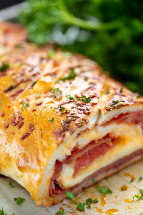 Zesty, cheesy and perfect for pizza night this Italian Meat Stromboli recipe is an easy and delicious addition to your weeknight routine! #italianmeatstrombolirecipe #stromboli #pizza Meat Stromboli, Appetizers Italian, Garlic Breads, Stromboli Recipes, Harvest Meals, Stromboli Pizza, Stromboli Recipe Easy, Recipes Sandwiches, Italian Entrees