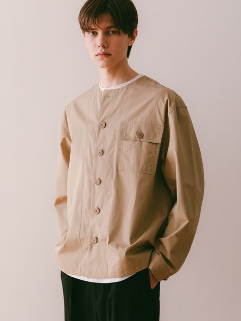 "Editor's NotesCrew neck shirt jacket beige from ESN is a collarless jacket product. It has a relaxed silhouette with button-down closure. It has a pocket detail on one side of the chest.- Relaxed fit- Dropped shoulder- Button details- High quality stitchesMeasurements (in.)- M / L- Shoulder: 20.8 / 21.2 in.- Chest: 22.8 / 24.4 in.- Sleeve length: 23.2 / 24.0 in.- Length: 27.5 / 28.3 in.*Model Information- Height: 6'0" Weight: 138.8 lbs. Size: LComposition & Care- 100% Cotton- Dry Clean Only Thailand Outfit, Collarless Shirt, Collarless Jacket, Stylish Men Casual, Jacket Beige, Slim Fit Suits, Crew Neck Shirt, Pocket Detail, Stylish Men