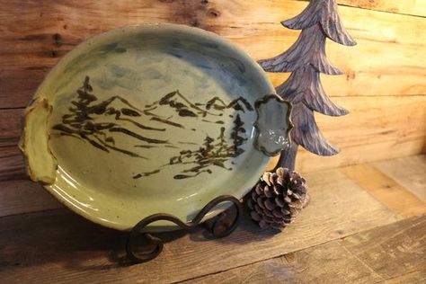 Green and brown mountain landscape platter. Hand painted scene made entirely with glazing techniques. Perfect serving platter size. Great for a wedding gift. Mountain Painted Pottery, Ceramic Painting Mountains, Pottery Mountain Design, Mountain Ceramics, Pottery Mug Mountains, Camping Plates, Pottery Platter, Mountain Drawing, Color Me Mine