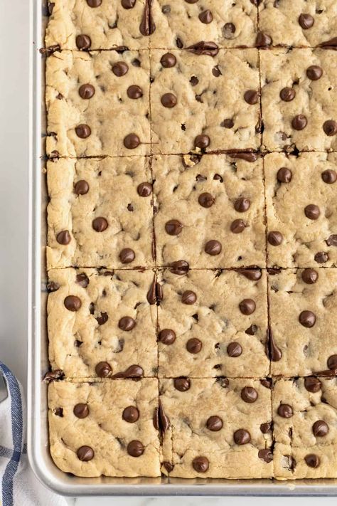 Sheet Pan Chocolate Chip Cookie Bars by The BakerMama Sheet Cake Cookie Bars, Sheet Cookie Bars, Chocolate Chip Cookie Bars Sheet Pan, Sheet Pan Bars Cookie Recipes, Chocolate Chip Pan Chewies 12 Tomatoes, Sheet Pan Blondies, Sheet Pan Bars For A Crowd, Sheet Pan Chocolate Chip Cookies, Sheet Cake Desserts For A Crowd