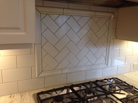 Detail behind stove. Renaissance house in west linn- large subway tiles with beige or gray grout. From realtor: granite color is white river. Subway tiles are 3x6. Grout is biscuit. Herringbone pattern over stove. White Beveled Subway Tile, Marble Herringbone Tile, Oak Kitchen Remodel, Tile Shower Niche, Pot Fillers, Gray Grout, Beveled Subway Tile, Flip Ideas, Subway Tile Backsplash Kitchen