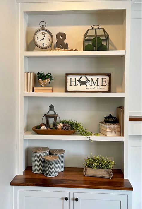 Brown Shelf Decor Living Room, Entertainment Center Shelf Decor, Vintage Decor Bookshelf, Modern Rustic Bookshelf Decor, Farmhouse Shelf Decor Living Room, Farmhouse Book Shelves For Den, Farmhouse Shelf Decor, Office Shelf Decor, Decorating Shelves In Living Room