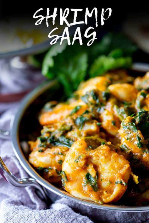 This Shrimp Saag is an earthy, flavorful curry made with juicy shrimp, onion, garlic, ginger, frozen spinach, and aromatic spices. This is an easy curry to make at home; you can find everything you need at the grocery store. The tender shrimp soak up all of the spices in this easy and delicious curry. If you love an Indian takeout, then try this at-home version, serve it with a side of rice, and you'll be blown away by the flavor. Indian Shrimp Recipes, Shrimp And Spinach Recipes, Indian Prawn Recipes, Indian Takeout, Saag Recipe, Prawn Dishes, Pescetarian Recipes, White Sauce Recipes, Prawn Curry