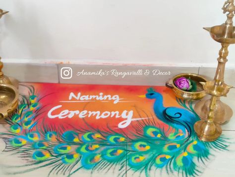 A glimpse of the Naming Ceremony's beauty. Rangoli+Decor+Name Reveal Board #NamingCeremony #TraditionMeetsBeauty #SpecialMoments #Celebration #ElegantDecor #BabyNaming #JoyfulOccasion #HeartfeltCelebration #anamikasrangavalli #namingceremonyrangoli Peacock Rangoli, Naming Ceremony, Elegant Decor, Baby Names, Beauty, Instagram