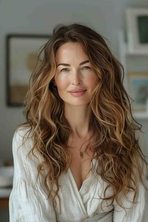 The Best Long Haircuts of 2024 Elegant Beach Waves Hair, Layered Beach Waves, Caramel Streaks, Braid Designs For Men, Beachy Wavy Hair, Messy Beach Waves, Best Long Haircuts, Wavy Beach Hair, Beach Waves Hair