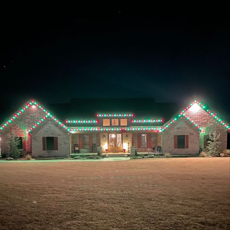 This beautiful home decorated for Christmas is from the custom build Ragsdale Project in Claremore, OK by Kennedy Homes. Check out the gallery to see more photos of this project. House Decorated For Christmas, Lights Outside, Christmas Lights Outside, Ranch Style House, Home For Christmas, Ranch Style Homes, Ranch Style Home, Holiday Decorating, Ranch Style