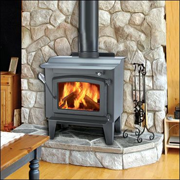 type of river rock wall behind free standing wood stove idea Free Standing Wood Stove, Prefab Fireplace, Best Wood Burning Stove, Wood Burning Stove Corner, Wood Stove Hearth, Small Wood Burning Stove, Wood Stove Wall, Wood Burning Stoves Living Room, Wood Burning Insert