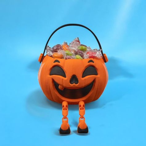 This Pumpkin Candy Bowl is the perfect addition to your Halloween festivities. Featuring a cheerful jack-o'-lantern face and whimsical black and orange witch legs, this candy bowl is perfect for serving treats to your guests, whether for a party or trick-or-treating! Halloween Candy Holder, Pumpkin Bowl, Whimsical Witch, Halloween Candy Bowl, Decorative Pumpkin, Pumpkin Bowls, Dessert Presentation, Witch Legs, Candy Display