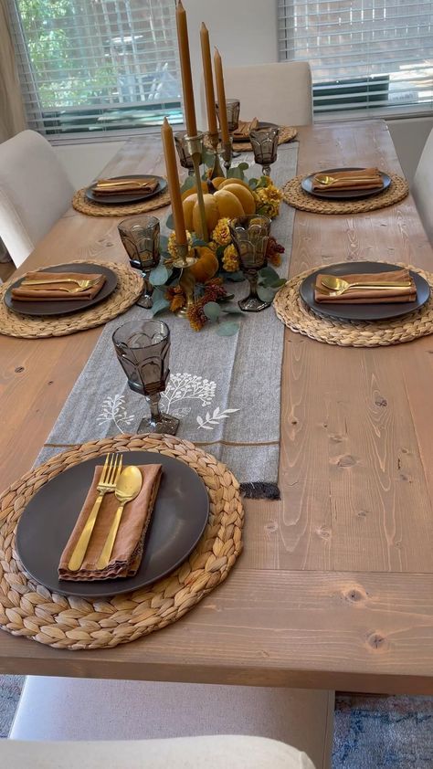 Use a rich red tablecloth and layer with green placemats. Center the table with a lush garland of evergreen branches, accented with pinecones and red ornaments. Finish with red candles of varying heights for a warm glow. Dinner Plate Set Up, Folding Table Holiday Decor, Table Set Up For Thanksgiving Dinner, Faux Pine Placemats, Table Setting Wooden Table, Fall Dinner Party Table Settings, Table Setting For 4 People, Big Table Decor, Brown Wood Table Decor