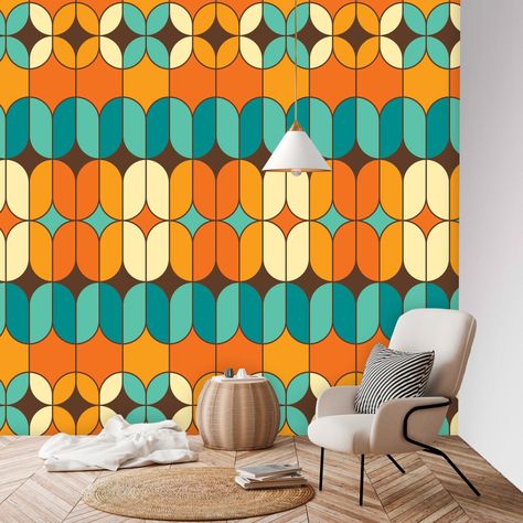 Imagine a wall mural that perfectly encapsulates the spirit of the 70s with a Mid-Century Modern twist. The wallpaper is designed with a vibrant color palette that primarily features shades of orange and teal blue. The pattern is geometric, with a mix of geometric and abstract shapes that interlock and overlap in a harmonious, yet dynamic arrangement. This design pays homage to the groovy aesthetics of the 70s, characterized by bold patterns and a sense of movement, while also embodying the slee Modern Peel And Stick Wallpaper, 70s Wall Mural, Mid Century Palm Springs, Mid Century Modern Christmas, Groovy 70s, 70s Decor, Mid Century Modern Walls, Retro Valentines, Bold Patterns