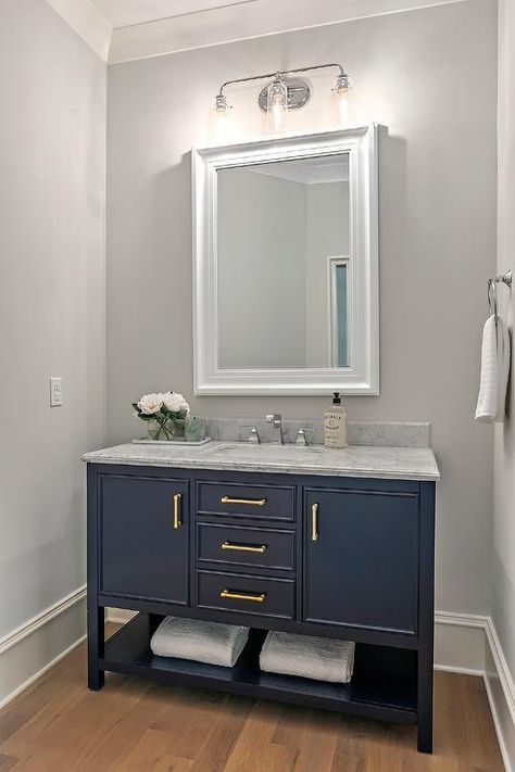 I love the color of wall, Mirror could be white trim. Maybe a more masculine light fixture. Love the deep blue with gold handles. Navy Blue And Gold Bathroom Vanity, Deep Blue Vanity Bathroom, Deep Blue Bathroom Vanity, Navy Blue Vanity Bathroom Wall Color, Grey And Navy Bathroom, Bathroom With Navy Blue Vanity, Bathroom With Blue Vanity, Blue Vanity Bathroom Ideas, Blue Bathroom Vanity Ideas