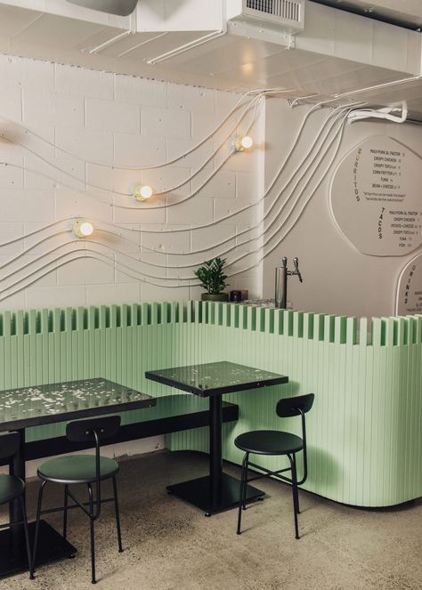 Canadian surf town informs design for taco restaurant by September Dark Restaurant, Light Green Paint, Eames Dining Chair, Vancouver Restaurants, Taco Restaurant, Modern Restaurant Design, Electrical Conduit, Modern Restaurant, White Ceiling