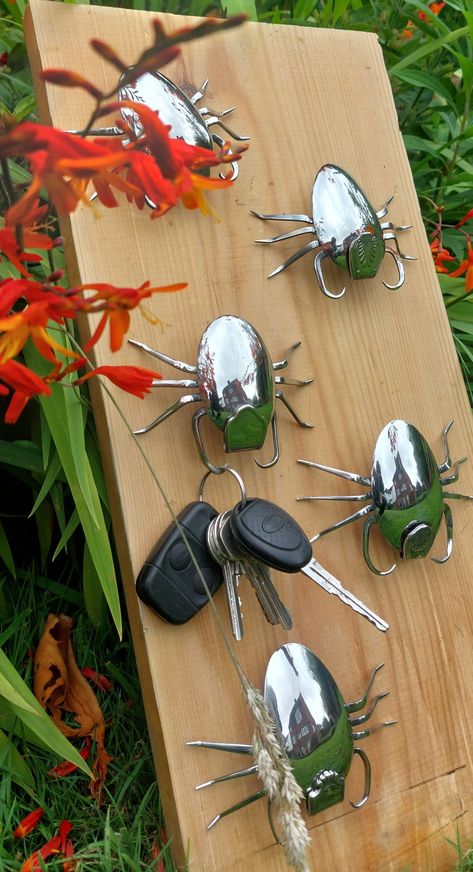 Cute Bug Key Hanger made from upcycled cutlery - Gift Ideas, Recycled Silverware, Hand made Item, Wall Art, Organizer. These Scorpion bugs can be mounted anywhere with a single nail or screw. Never lose your keys again with this unique, fun and functional stainless steel guardian watching over them! Made from reclaimed materials: Two dessert spoons Two forks 2 patterned handles Please note, all bugs are broadly similar but there may be some subtle variation in design / pattern. Contact me direct Bugs Made Out Of Recycled Materials, Old Key Crafts, Art Organizer, Bug Gifts, Recycled Silverware, Cutlery Art, Welding Crafts, Insect Crafts, Silverware Art