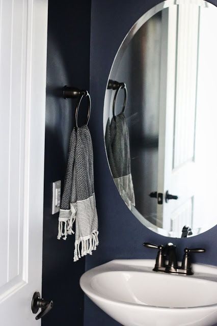 Benjamin Moore Hale Navy in a windowless bathroom Hale Navy Small Bathroom, Benjamin Moore Hale Navy Bathroom, Powder Room Blue Paint, Navy Painted Bathroom, Navy Bathroom Accent Wall, Hale Navy Benjamin Moore Bathroom, Navy Paint Bathroom, Windowless Powder Room Ideas, Navy Blue Small Bathroom