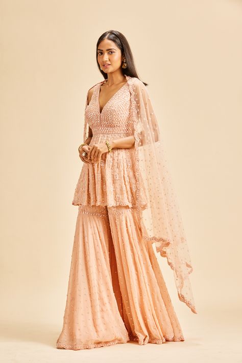 #NitikaGujral #Sharara #WeddingSharara #ShararaDesign #Weddingwear #Indianweddingwear Peach Sharara Suit, Peplum Sharara, Diwali Dress, Wedding Sharara, Sequin Set, Georgette Sharara, Peach Color Dress, Designing Clothes, Diwali Dresses