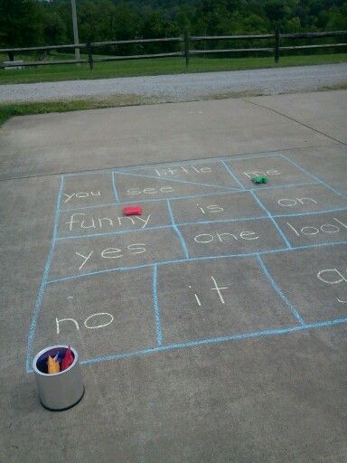 I wrote some of the sight words my grandson knows/is learning and he had to read the word the bean bag landed on. He loved it! Tricky Word Games, Outdoor Kindergarten, Outdoor Learning Activities, Cvc Word Activities, Tricky Words, Eyfs Activities, Sight Words Kindergarten, Sight Word Games, Sight Word Activities