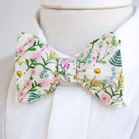 "Dapper Men's Wildflowers In Pink Freestyle Self-Tie Bow Tie Made By The Belle And The Beau! ♥ This beautiful cotton floral fabric is part of our new Wildwood Collection designed by Rifle Paper Co! We have been approved by Rifle Paper Co to make our products in these fabrics- that means we will be ordering bolts regularly! Yay! Our extraordinary, modern, and stylish freestyle self-tie bow ties are perfect for everyday, Sunday best, all special occasions, photography sessions, and especially dapp Bowties Men's, Floral Bow Tie, Suits Men, Wedding Plan, Boys Bow Ties, Wedding Order, Wildflower Wedding, Wedding Ties, Mens Bow Ties