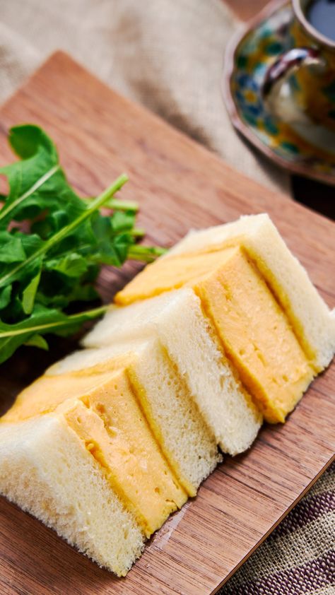 This Kyoto style Dashimaki Tamago Sando stuffs a tender, fluffy Japanese omelette between two thick slices of shokupan (Japanese sandwich bread) to make for a delightfully flavorful and satisfying egg sandwich. Japanese Egg Omelette, Dashimaki Tamago, Japanese Egg Sandwich Recipe, Best Egg Sandwich, Handheld Recipes, Japanese Sandwiches, Japanese Egg Sandwich, Asian Potluck, Tamago Sando