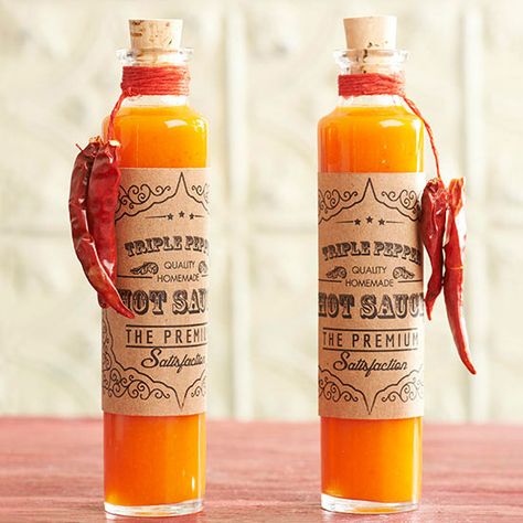 Triple-Pepper Hot Sauce--Three kinds of chile peppers make this hot sauce a perfect food gift for the daredevil in your life. Print our custom labels and tie mild dried chiles onto the bottles. Hot Sauce Packaging, Photo Theme, Lavender Cookies, Pepper Recipe, Chile Peppers, Diy Food Gifts, Homemade Food Gifts, Hot Sauce Recipes, Christmas Food Gifts