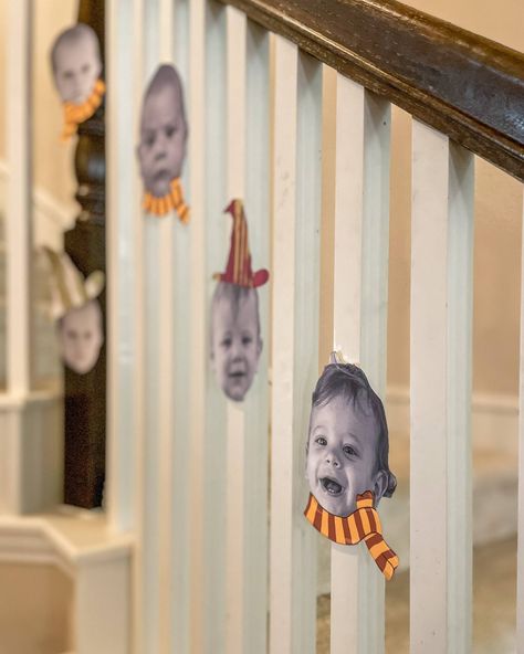 baby's face cut out wearing harry potter gryffindor colored scarves and hats