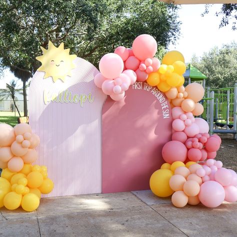 First Trip Around The Sun ☀️ Backdrop + Balloons + Favor Wall @janettloveshop Decor by mom @jennygekas #firsttriparoundthesun #firsttriparoundthesun☀️ #firsttriparoundthesunparty #firstbirthday #firsttriparoundthesuntheme #firsttriparoundthesunbackdrop #firstbirthdayparty #suntheme Pink And Yellow Backdrop, 1 In The Sun Birthday, One In The Sun First Birthday Girl, First Trip Around The Sun Girl Birthday Party Girl, First Trip Around The Sun Balloon Arch, First Trip Around The Sun Backdrop, Sunshine 1st Birthday Party Girl, Sun Backdrop, Summer First Birthday