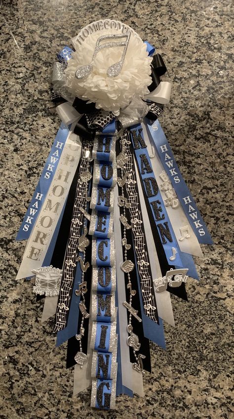 Senior Homecoming Mums 2023, Hoco Garder Ideas, Homecoming Garters For Guys Senior, Freshmen Homecoming Mums, Homecoming Mums Dance Team, Mum And Garter Ideas, Cross Country Mums Homecoming, Themed Homecoming Mums, Mums Blue And White