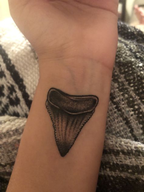 Great white shark tooth tattoo Small Shark Tattoo, Great White Shark Tooth, Shark Tooth Tattoo, Nautical Tattoo Sleeve, Great White Shark Teeth, Rib Tattoos For Guys, Tooth Tattoo, Wave Tattoo Design, Mark Tattoo