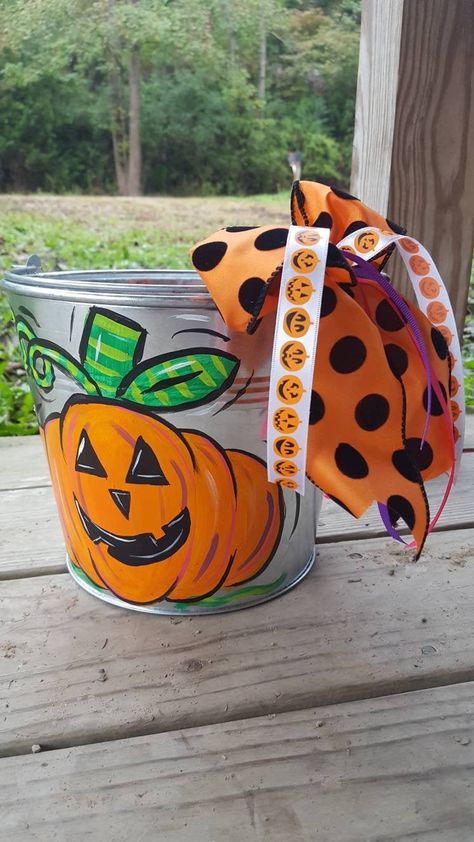 "Tin Pails are painted to fit your needs! This listing is for the Happy Jack! Boy or Girl or neutral! I put a sealer on all buckets. That way you can re use them next year or use them for toy storage! Please include name of child if you would like that added to pail. If you dont like polka dots just put in note to seller and I will leave them off! Please specify if you want name on side of pumpkin or back of pail and color. MESSAGE ME AND WE WILL CREATE WHATEVER YOU DREAM UP! Also available for Painted Buckets Ideas Galvanized Metal, Painted Halloween Buckets, Painted Buckets Ideas, Metal Tin Bucket Ideas, Halloween Buckets Ideas, Diy Halloween Buckets, Painted Metal Buckets, Painted Buckets, Personalized Halloween Bucket