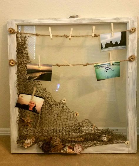 Shabby Beach themed 1940's barn glass window pane. Nautical theme. Net with sea shell decor and old fishing rope for hanging beach photos. Fishing Bedroom, Photobooth Photos, Window Display Retail, Nautical Living Room, Window Projects, Craftsman Exterior, Beach Room, Sea Shell Decor, Shell Decor