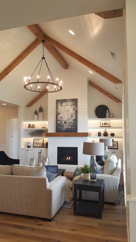 Peaked Ceiling Lighting, High Ceiling Beams Living Room, Fireplace With Peaked Ceiling, Living Room Ceiling With Beams, Fireplace Ideas Vaulted Ceiling, Light Fixtures For Vaulted Ceilings, Great Room Light Fixture Vaulted Ceiling, Vault Ceiling Fireplace, Bolted Ceiling Living Rooms