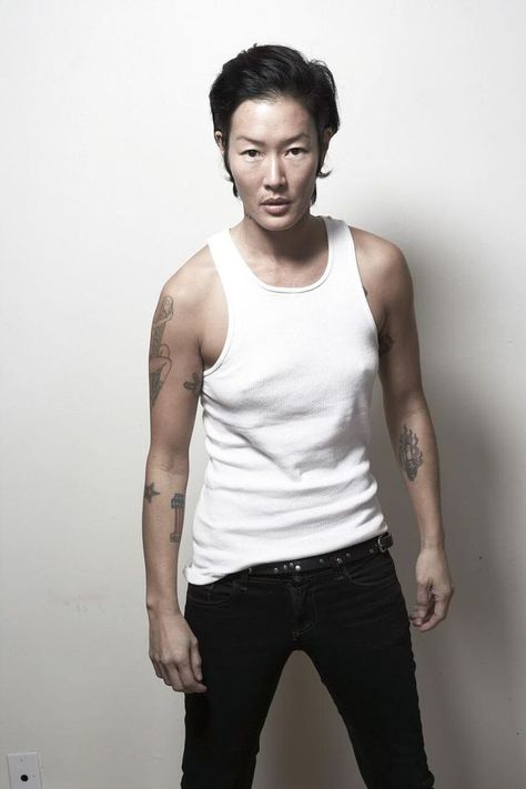 Jenny Shimizu, in this photo found on Tumblr, is a good example of a modern masculine lesbian. Very open about her sexuality, Shimizu is wearing a wife beater shirt while standing in a very masculine pose. Making her very in touch with masculine lesbian. Wife Beater Outfit, Wife Beater Shirt, Andro Style, The New Age Lifestyle, Jenny Shimizu, New Age Lifestyle, Tomboy Swag, Lacey Bra, Wife Beaters