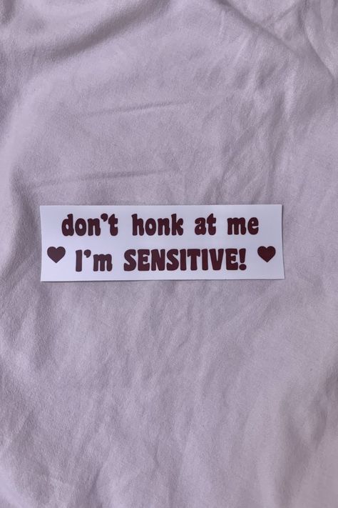 Offwhite bumper sticker that reads "don't honk at me I'm sensitive" in a dark maroon text. 2 hearts on the side. I'm Sensitive, Bumper Sticker, Vinyl Stickers, The North Face Logo, Bumper Stickers, Retail Logos, Vinyl Sticker, Dishwasher Safe, Vinyl