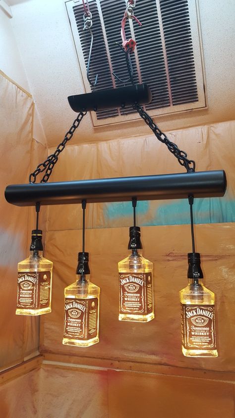 Rustic Bar Lighting Ideas, Liquor Bottle Lights Hanging, Beer Bottle Decor, Glass Bottle Diy Projects, Liquor Bottle Lights, Pallet Light, Diy Bottle Lamp, Liquor Bottle Lamp, Game Room Ideas