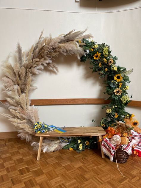 Pampas grass and greenery with sunflower circle arch for a backdrop for events to celebrate ukraine Pampas Grass And Greenery, Sunflower Circle, Circle Arch, Pampas Grass, Ukraine, Sunflower, Arch