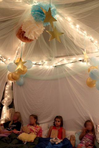 DIY party tent - I've done something similar to this with the girls' bunk beds. Diy Party Tent, Glamping Birthday Party, Xmas Tree Lights, Glamping Birthday, Girls Slumber Party, Glamping Party, Pijama Party, Sleepover Birthday Parties, Kids Camping