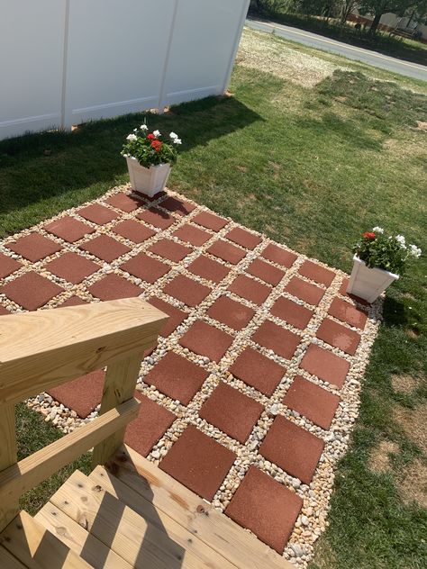 This easy DIY patio is perfect for your summer bbq. For a smaller space. 9x9 for less than $100 49 12x12 pavers 11 bags of yellow river rock  Shovel Rake Measuring flags  Measuring tape. That’s all you need to do this easy project. #diy #project  #patio Diy Simple Patio, Diy Front Patio Ideas Budget, Creating A Patio On A Budget, Cheap Diy Backyard Patio Ideas Simple, Patio Using 12x12 Pavers, Easy Diy Backyard Patio, Budget Patio Decor, Diy Outdoor Patio Ideas Budget Backyard, Diy Cheap Patio Ideas