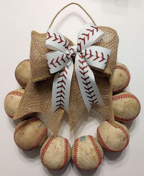 PRICES MAY VARY. Made with real baseballs in the USA! USED BASEBALLS WREATH - This wreath is made with 10 real leather baseballs that were used in youth games and practices. Measures appx. 12" wide and weighs appx. 3.5 lbs. Perfect for baseball families and maybe even baseball players who have their own place that don't want anything too fancy hanging on their door! White baseball stitch bow. Each wreath is unique and may be slightly different than the wreath pictured. Hand-made by a baseball fa Baseball Project, Baseball Wreaths, Baseball Family, Baseball Decor, Youth Games, Baseball Stitch, Door White, Base Ball, Mom Era