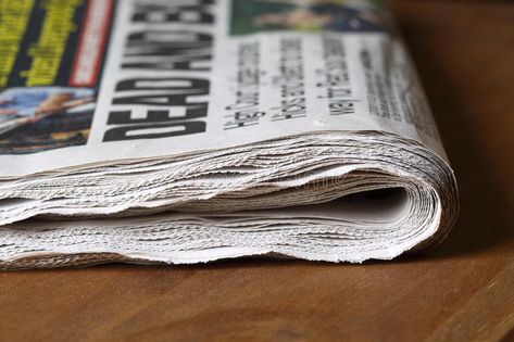 Newspaper. Photograph of a folded newspaper on a wooden table #Sponsored , #sponsored, #PAID, #Photograph, #table, #wooden, #Newspaper Folded Newspaper, Stock Photography Free, Newspaper, Wooden Tables, Presentation Design, Free Design, Stock Images