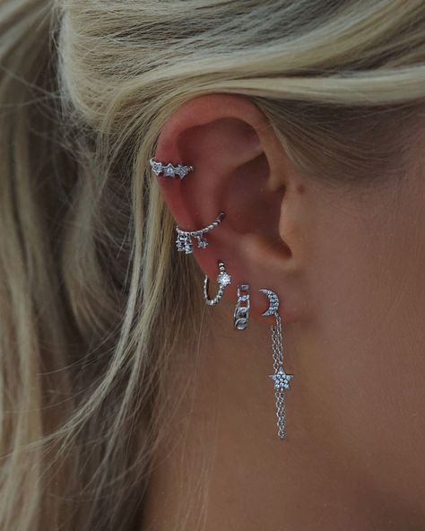 Silver jewellery 🤝 celestial designs✨ Shop your favourite styles in our Black Friday sale!🖤 Earring Styling Silver, Silver Earring Styling, Cute Silver Earrings Aesthetic, Silver Earrings Stack Aesthetic, Silver Jewelry Stack Earrings, Ear Piercing Inspo Silver, Silver Earing Stacks, Piercings Ear Silver, Earing Stacks Silver