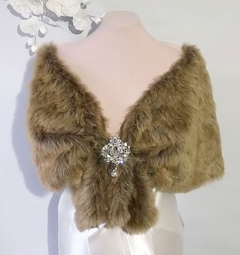 Wedding cape light brown fox , Faux fox fur shawl,Bridal cape ,Faux Fur Cape This elegant faux fur capelet  with brooch was designed for that special day or evening wedding. The design of this capelet is elbow length.  (Measures Approx 20" , Will Fit Up To 55 inch circumference (Fits Small -Plus size)  Since every garment is created  for you -  For best accurate results, measure as indicated in the picture yourself& compare with the detailed size chart below: X-Small       37 in           small Fur Capelet, Faux Fur Cape, Hollywood Costume, Fur Cape, Wedding Cape, Bridal Cape, Fur Shawl, Medieval Fashion, Evening Wedding