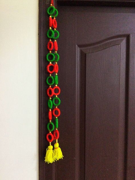 Wollen Crafts Ideas, Door Hanging Decorations Toran, Door Hanging Decorations Diy, News Paper Crafts, Divali Decoration, Diy Moving, Diy Wall Hanging Crafts, Door Toran, Wool Crafts Diy