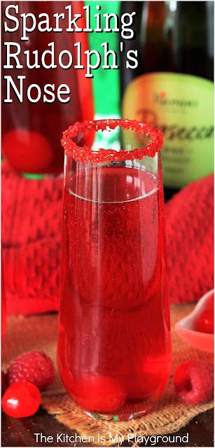 Sparkling Rudolph's Nose Christmas Cocktail ~ With its tasty combination, bright red hue, & adorable Rudolph's nose in the bottom of the glass, a Sparkling Rudolph's Nose is the perfect cocktail for Christmas! www.thekitchenismyplayground.com Rudolph Cocktail, Red Alcoholic Drinks, Gathering Recipes, Fruity Mixed Drinks, Red Drinks, Frozen Christmas, Cocktails Recipes, Christmas Foods, Christmas Cocktail