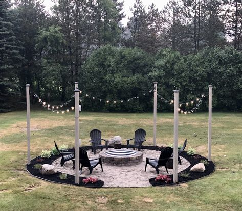 Fire Pit Areas With Gravel, Gravel Firepit Area, Backyard Campfire Pit, Fire Pit Landscaping Ideas Pea Gravel, Gravel Fire Pit Area With Lights, Sand Fire Pits, Firepit Lighting Backyard Ideas, Round Fire Pit Area With Gravel, Outdoor Fire Pit Area