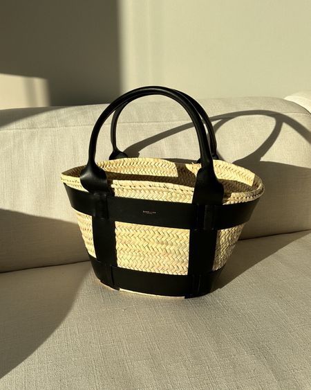 DeMellier tote! I love this raffia basket bag for pool days or vacation! #LTKitbag #LTKtravel #LTKswim Raffia Basket, Pool Bag, Black Basket, Vintage Designer Bags, Pool Days, Basket Bag, Resort Style, Vintage Designer, Woven Bag